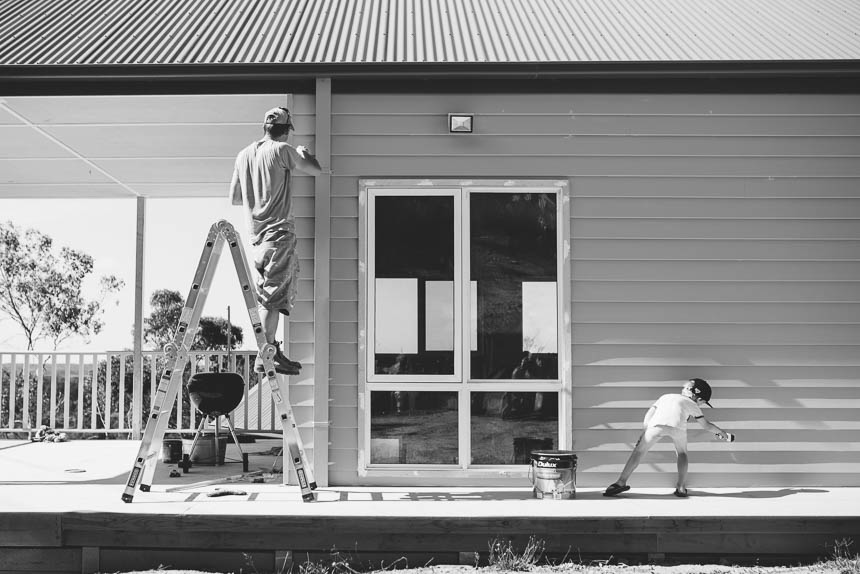 man and child do exterior house painting - Documentary Family Photography