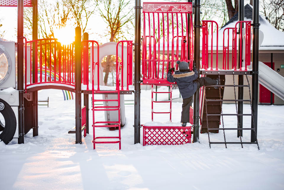 kid climbs up playground - Documentary Family Photography