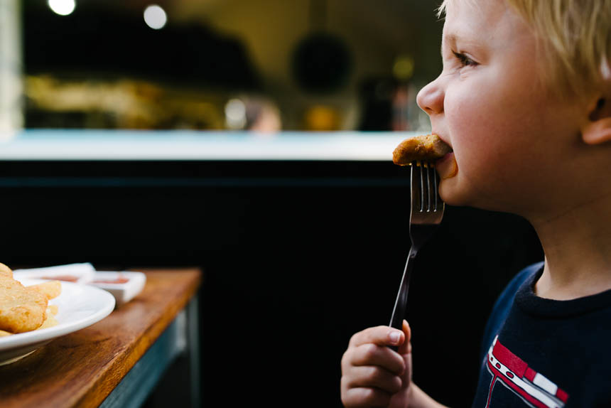 boy eats bite off fork - Documentary Family Photography