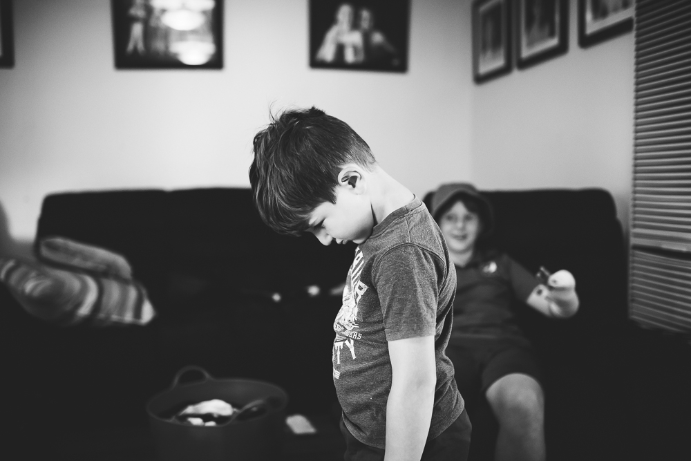 boy hanging head - Documentary Family Photography