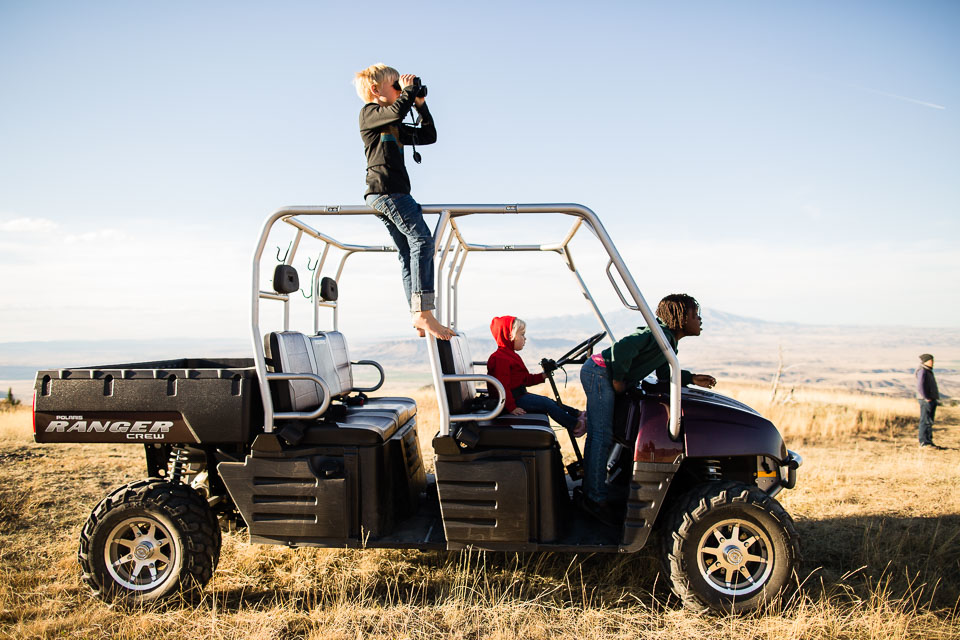 children in jeep on African Plains 