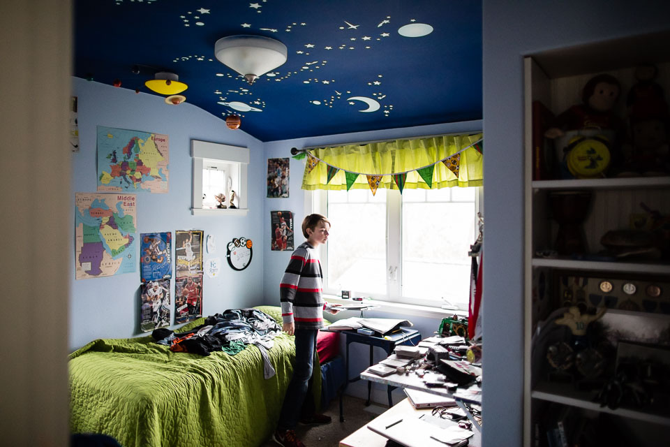 boy in messy room