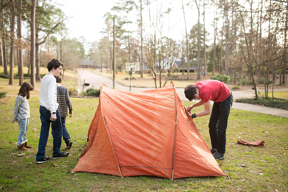 Family putting up tent - Documentary Family Photography