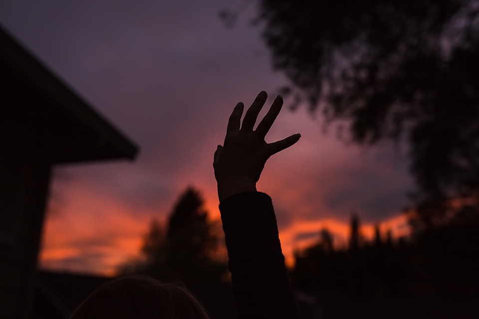 silhouette of hand in air at sunset- Documentary Family Photography