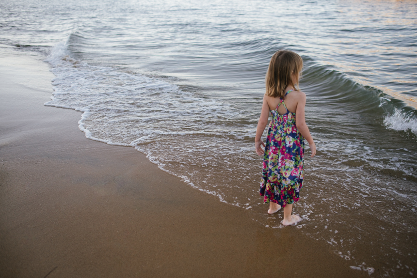 girl standing on ocean shore - Documentary Family Photography