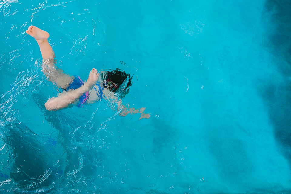 child jumps in pool - Documentary Family Photography