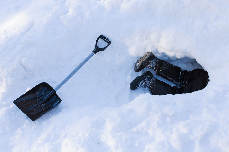 kids legs sticking out of snow pile - Documentary Family Photography