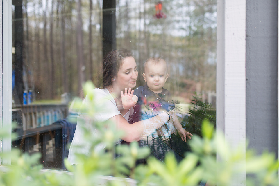 girl at window with baby - Documentary Family Photograpy