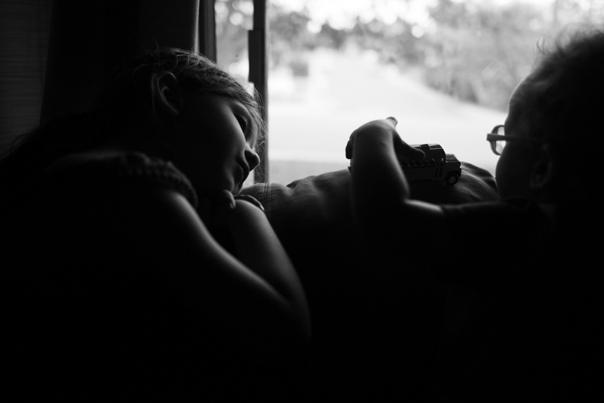 girl looks out window - Documentary Family Photograpy