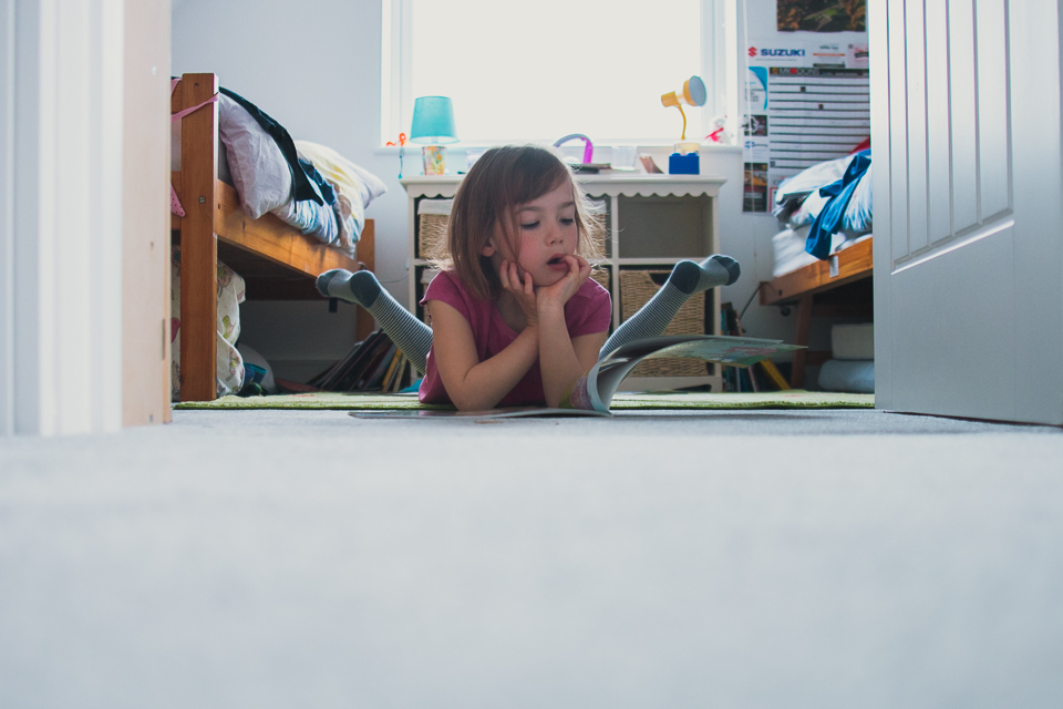 girl reading on floor - Documentary Family Photograpy