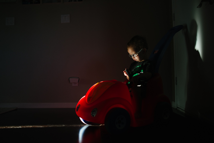 Little boy plays in shadows - Documentary Family Photography