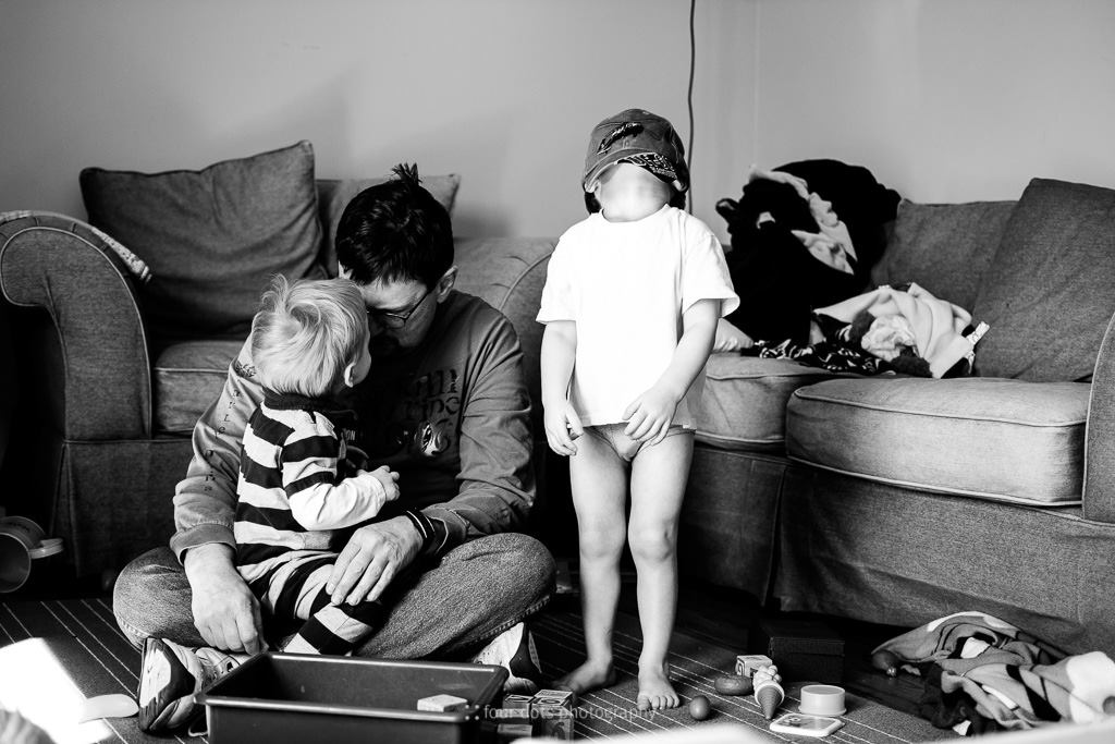 bored boy with underwear on head - Documentary Family Photography
