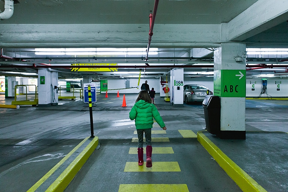 girl on cross walk in parking garage - documentary family photography