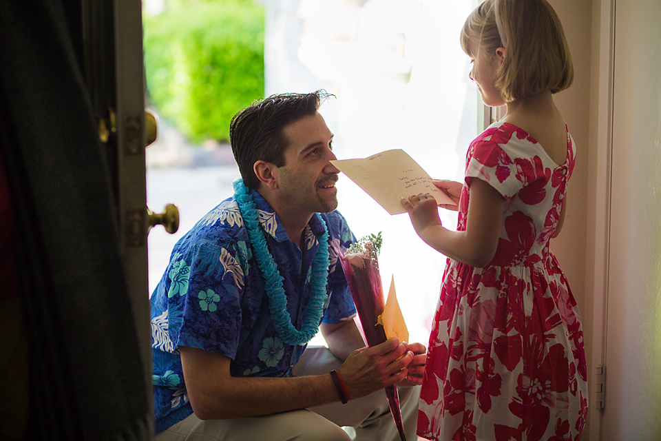 father gives daughter flowers - documentary family photography