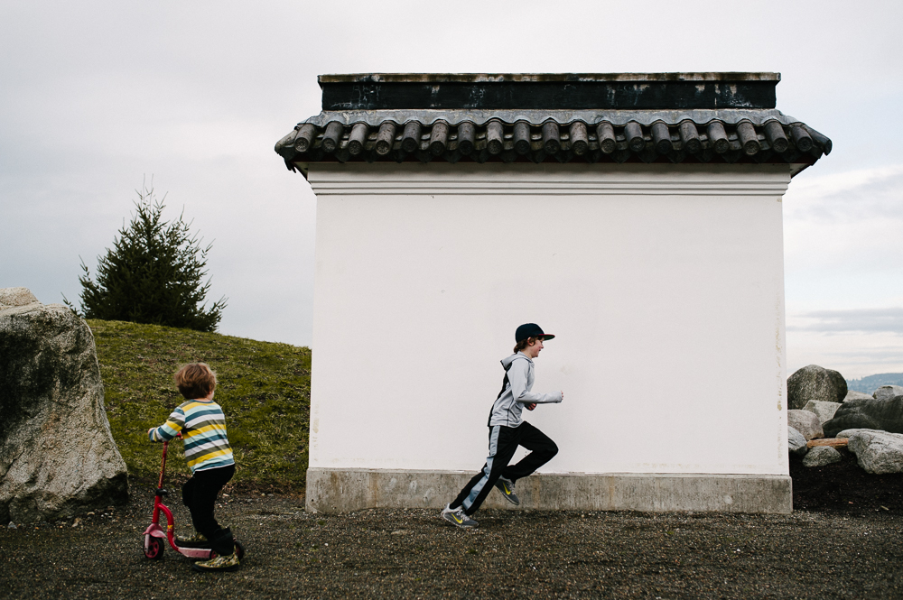 boys running near out building - documentary family photography
