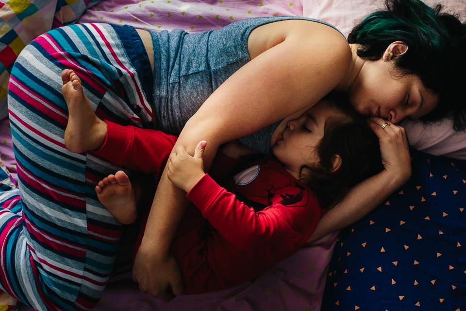 boy nurses in bed - Documentary Family Photography