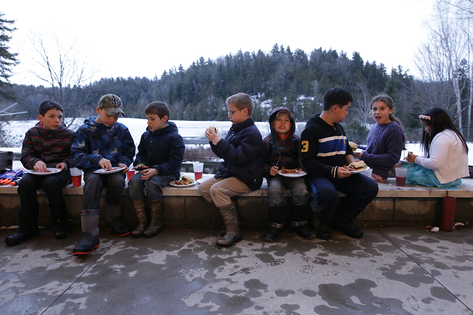 Boys eat outside in winter weather - Documentary Family Photography