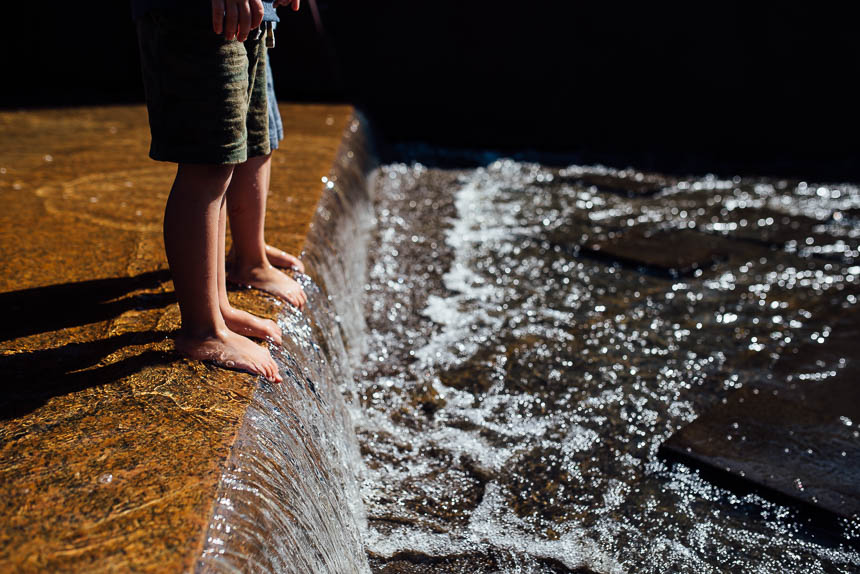 boys stand in fountain - Documentary Family Photography