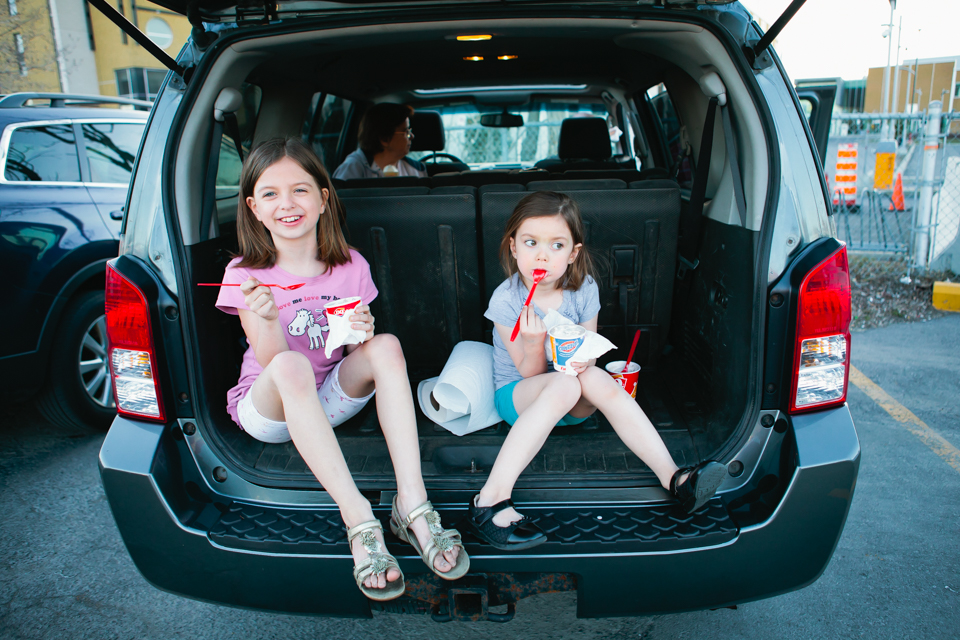 girls eating popsicles in trunk of car - Documentary Family Photography
