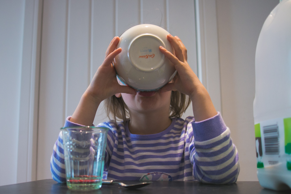 girl drinks from bowl - Documentary Family Photography