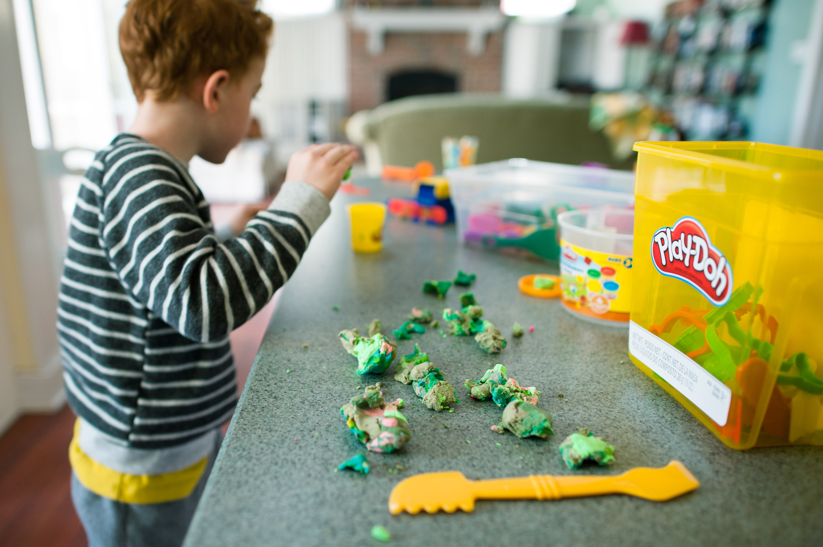 boy with mixed up playdoh - Documentary Family Photography