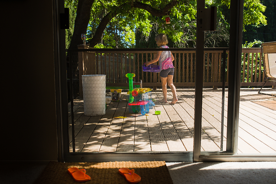 girl plays on porch - Documentary Family Photography