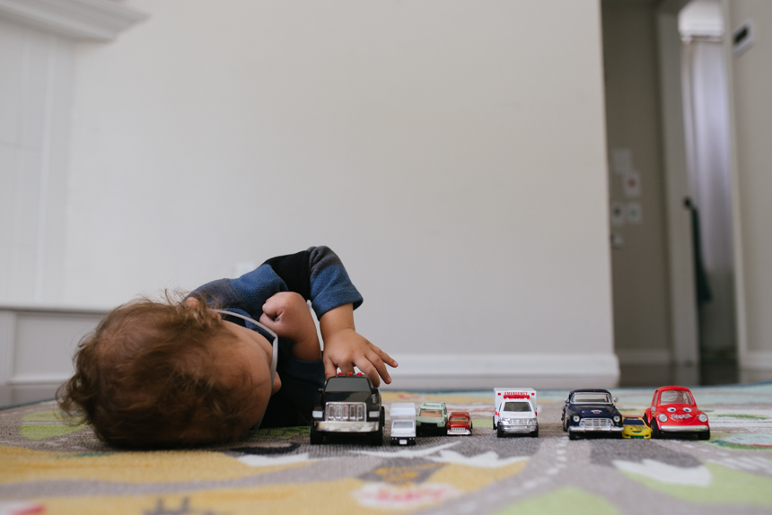 boy with cars lined up - Documentary Family Photography