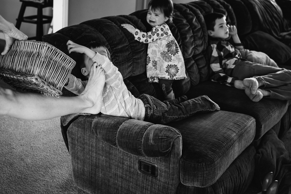 kids throw fit on couch - Documentary Family Photography