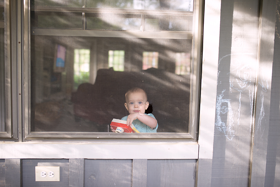 baby in window -Documentary Family Photography