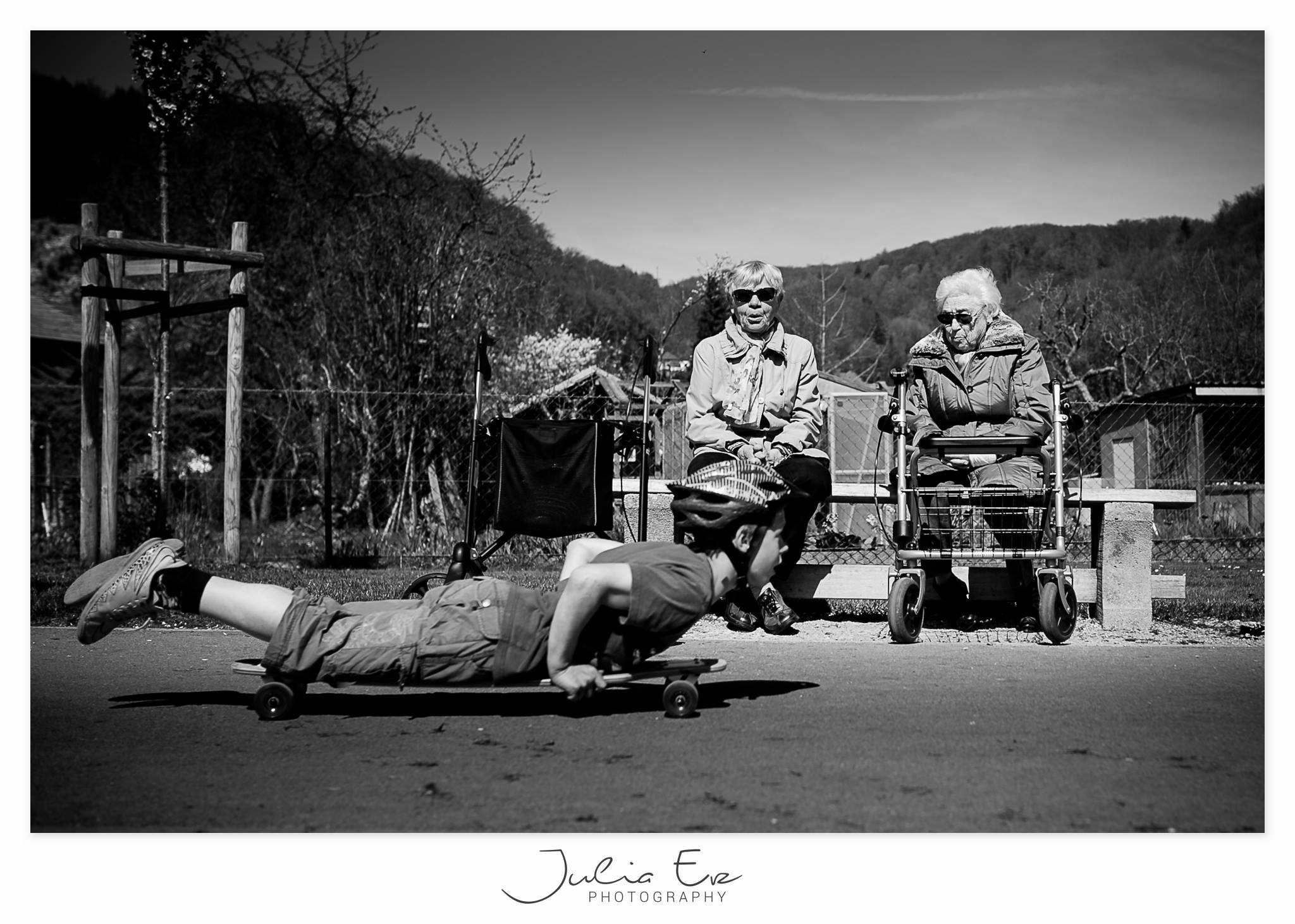 kid on skateboard as seniors watch - Documentary Family photography