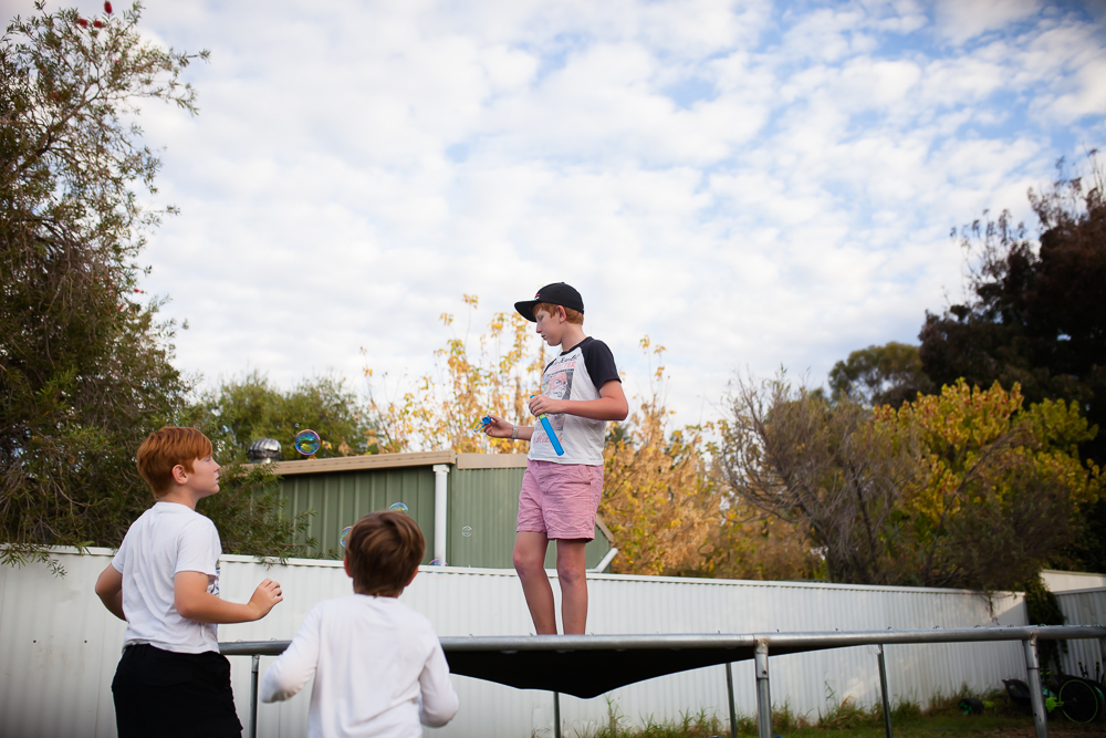 boy on trampoline - Documentary Family Photography