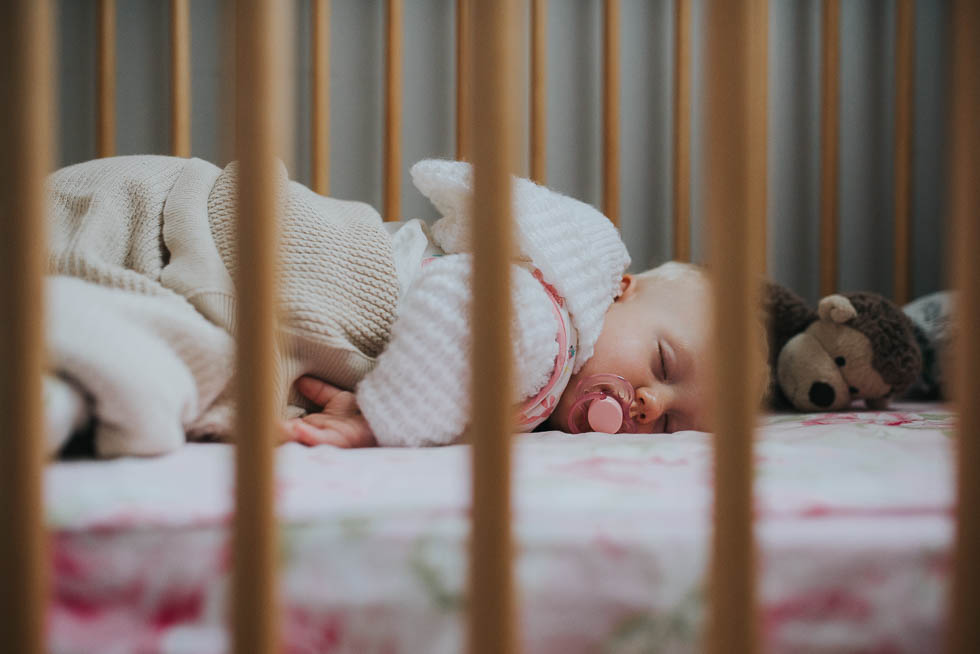 baby napping in crib - Documentary Family Photography