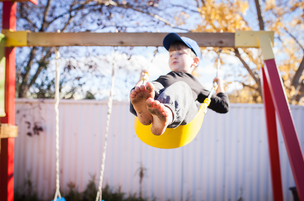 boy on swing - Documentary Family Photography