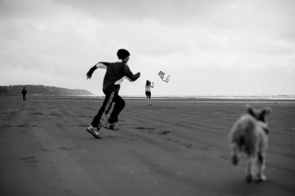 family runs on beach - Documentary Family Photography
