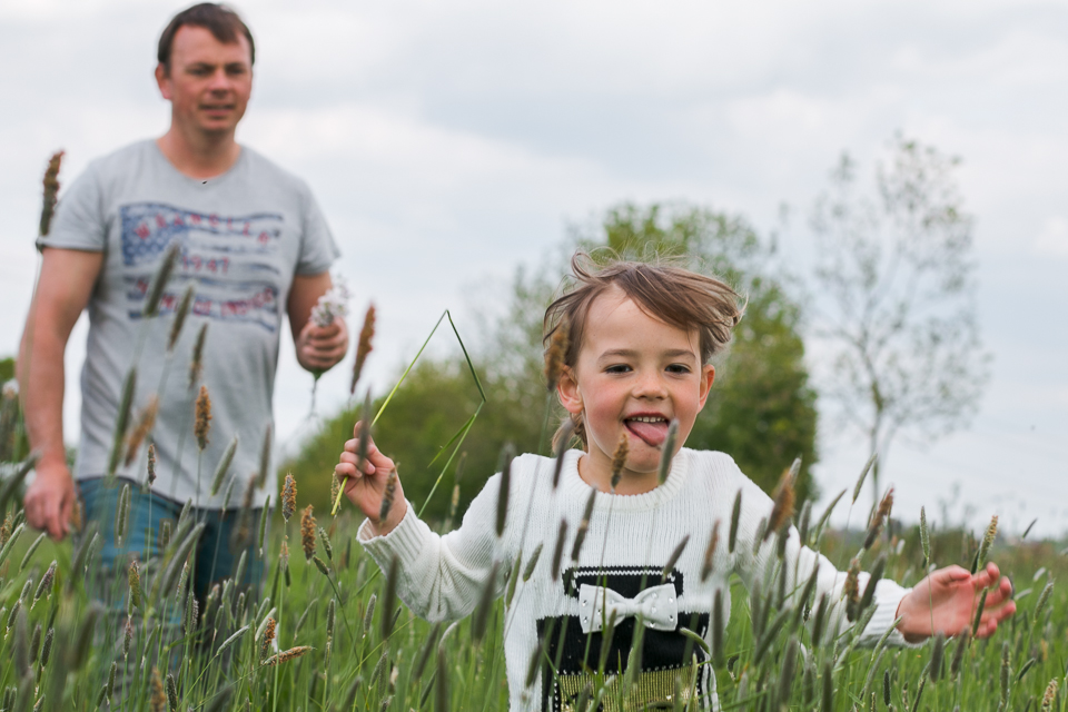 child runs in field - Documentary Family Photography