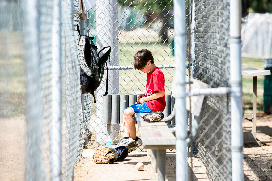 boy in dugout - Documentary Family Photography