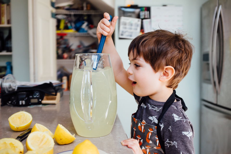 boy stirs lemonade - Documentary Family Photography