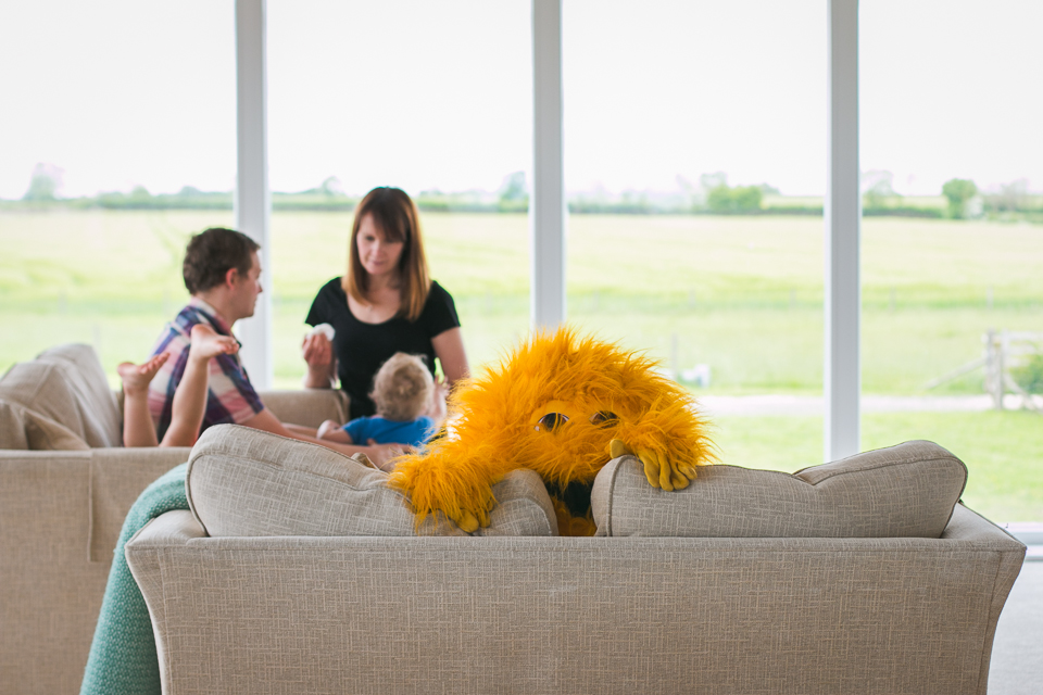 toy monster on couch - Documentary Family Photography