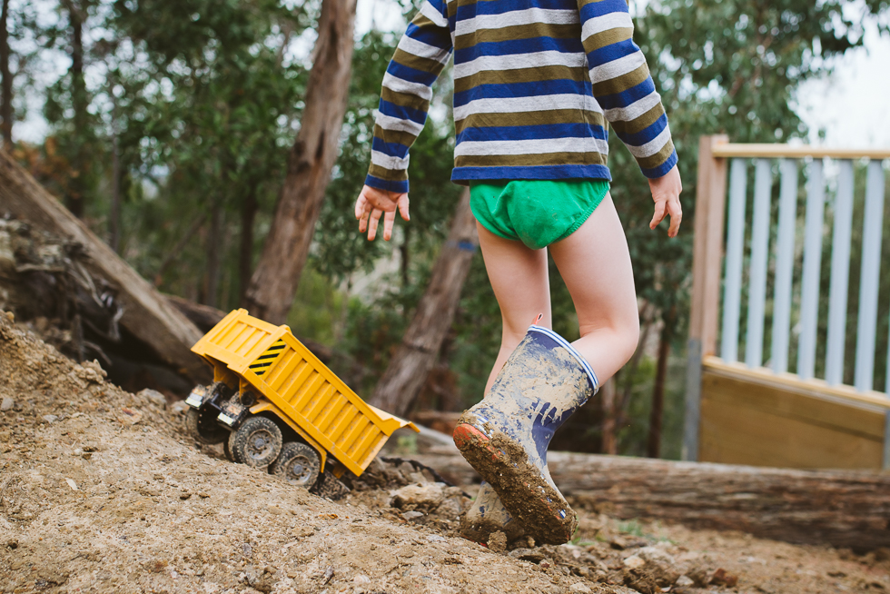 boy plays in mud - Documentary Family Photography