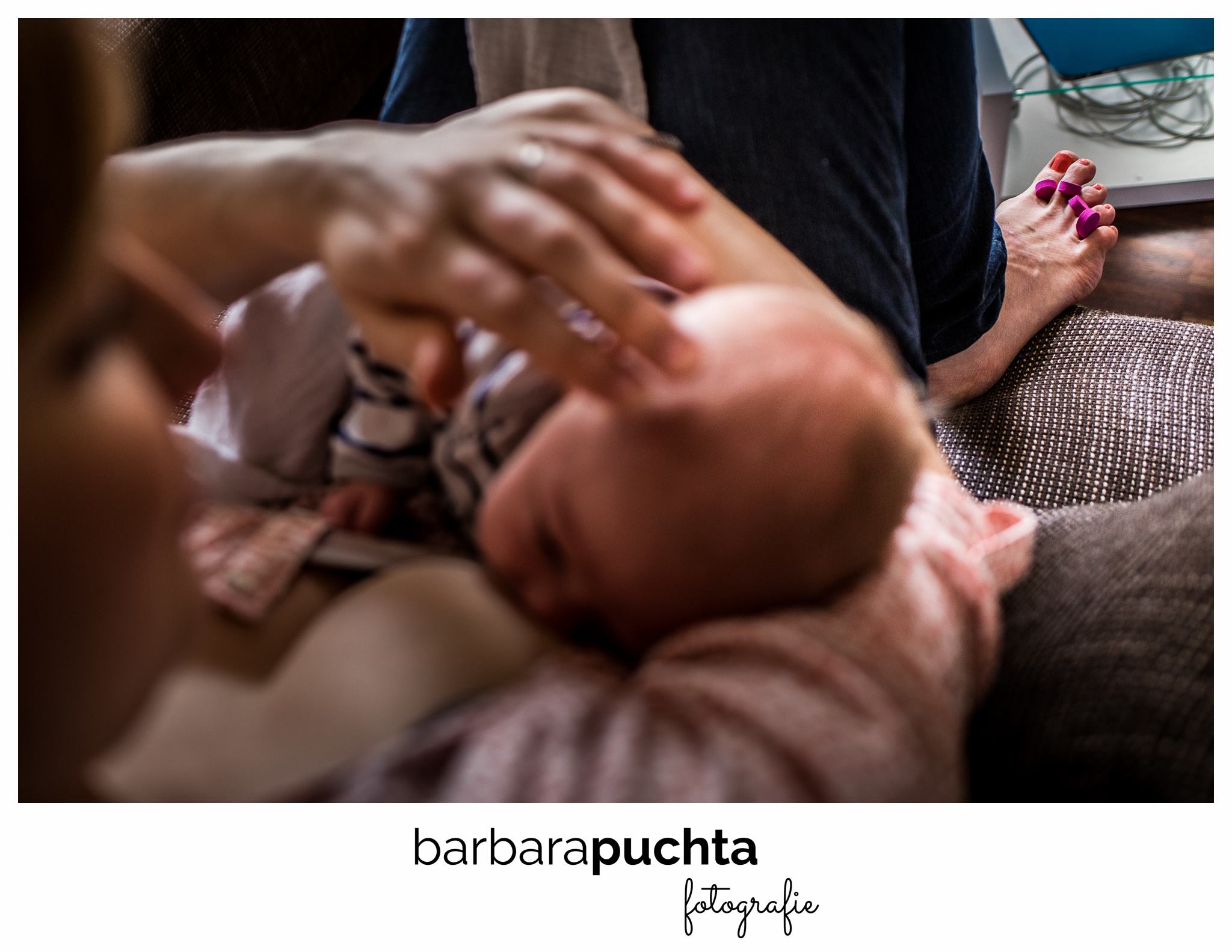 mother nurses while painting her toes - Documentary Family Photography