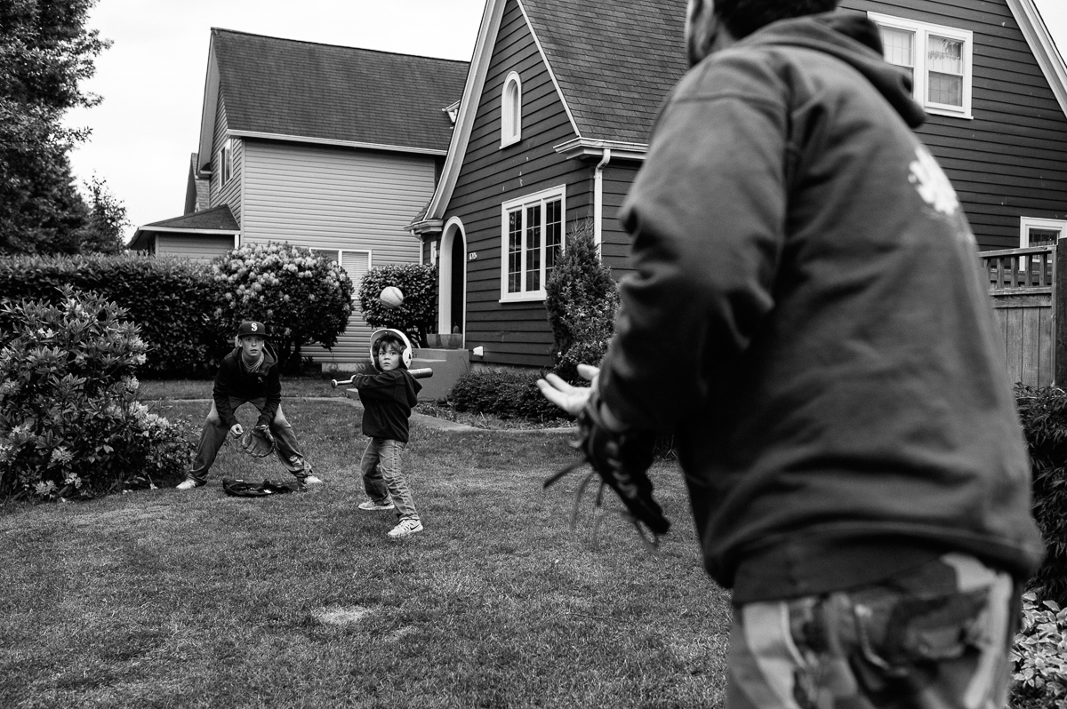 kids playing with ball in backyard - Documentary Family Photography