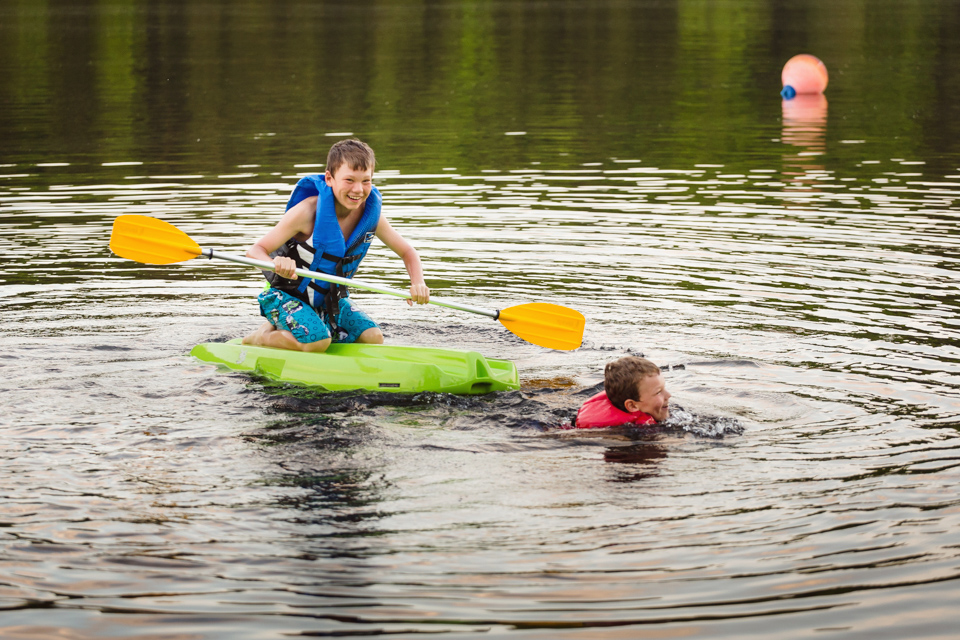 kids on water craft - Documentary Family Photography