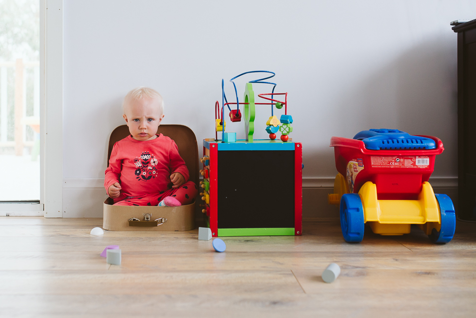 baby in toy suitcase - Documentary Family Photography