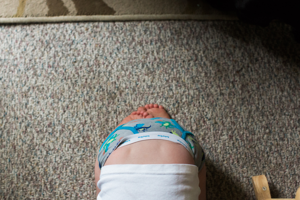 child crouched on floor - Documentary Family Photography