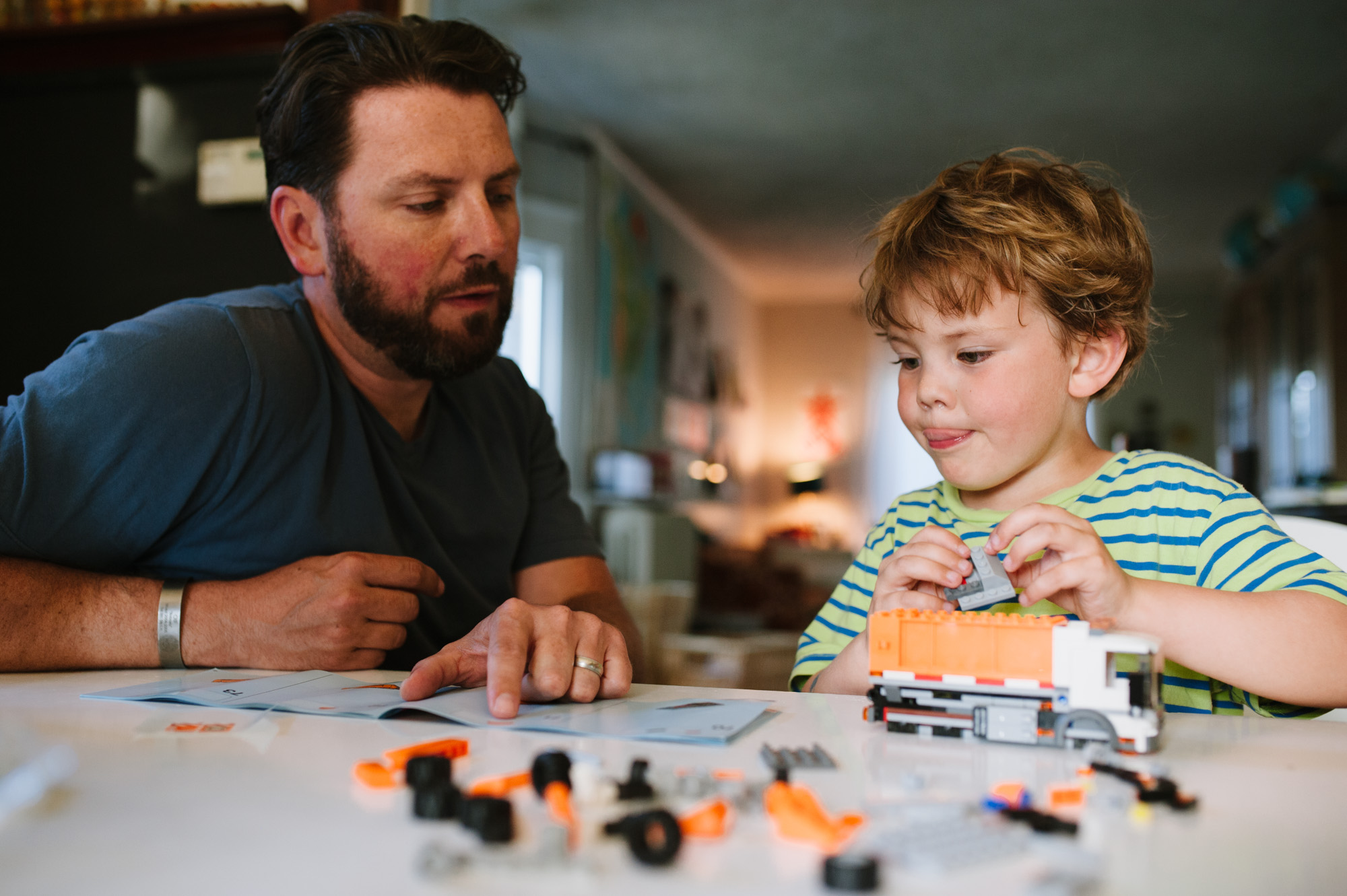 boy playing with father - Documentary Family Photography