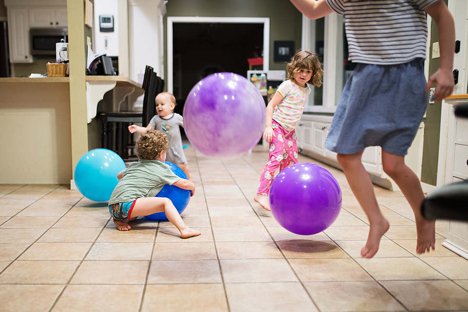 kids with large playground balls - Documentary Family Photography