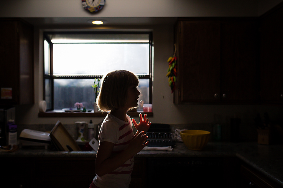 silhouette of girl in window - Documentary Family Photography