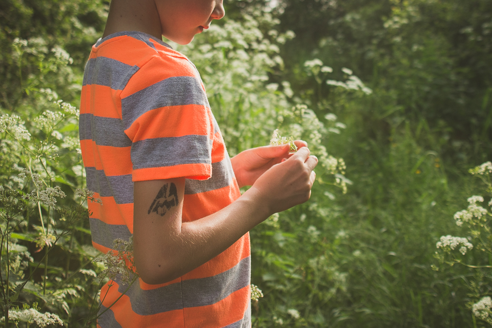 child with flower - Documentary Family Photography