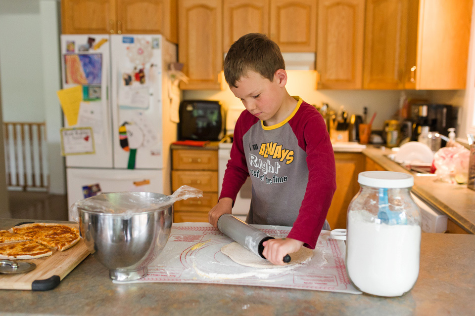 boy rolling out dough - Documentary Family Photography