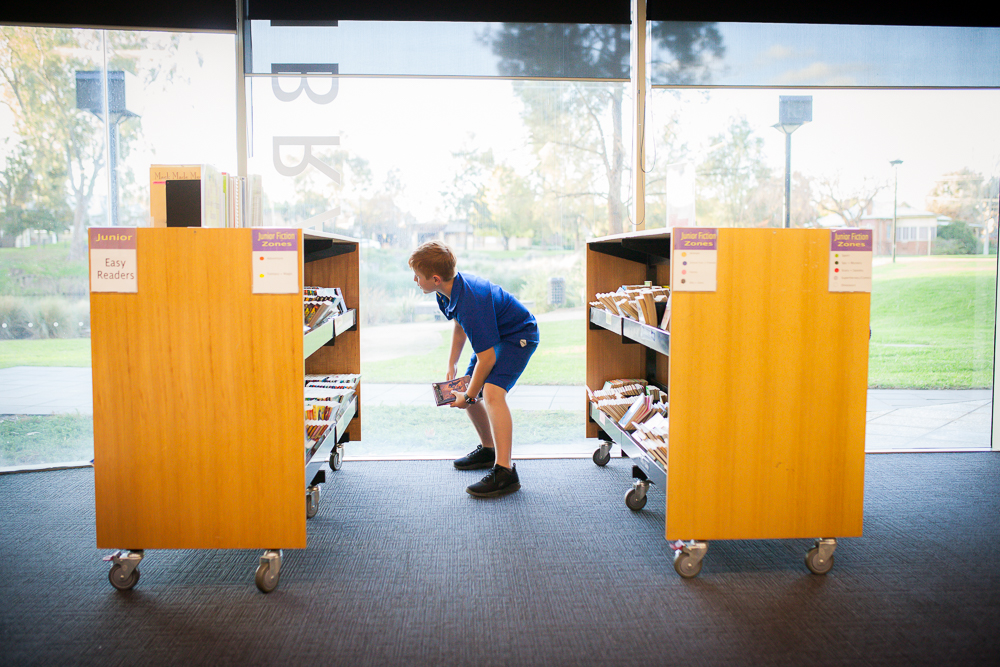 boy in library - Documentary Family Photography